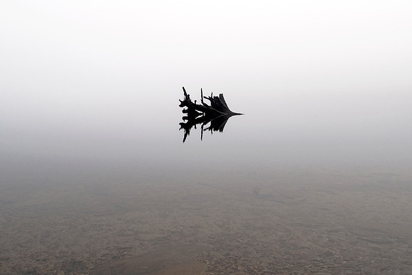 Lake Fading Into The Fog