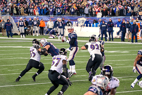Tom Brady in The Pocket Looking for Julian Edelman versus the Ra