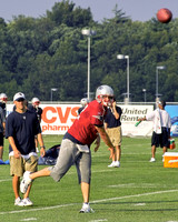Tom Brady fires a pass as OC Josh Mcdaniels looks on.